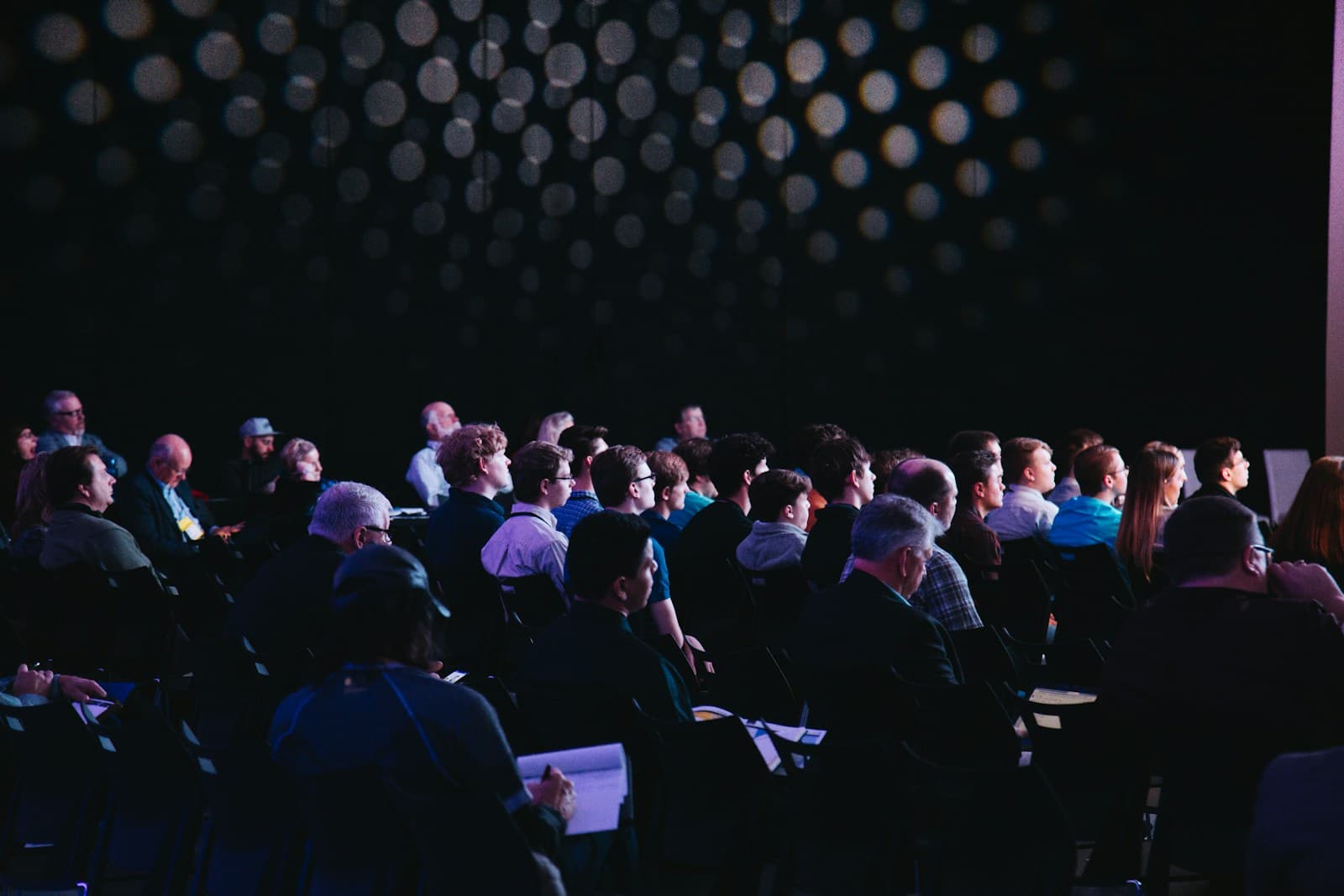 Conference audience seated for a ticketed session